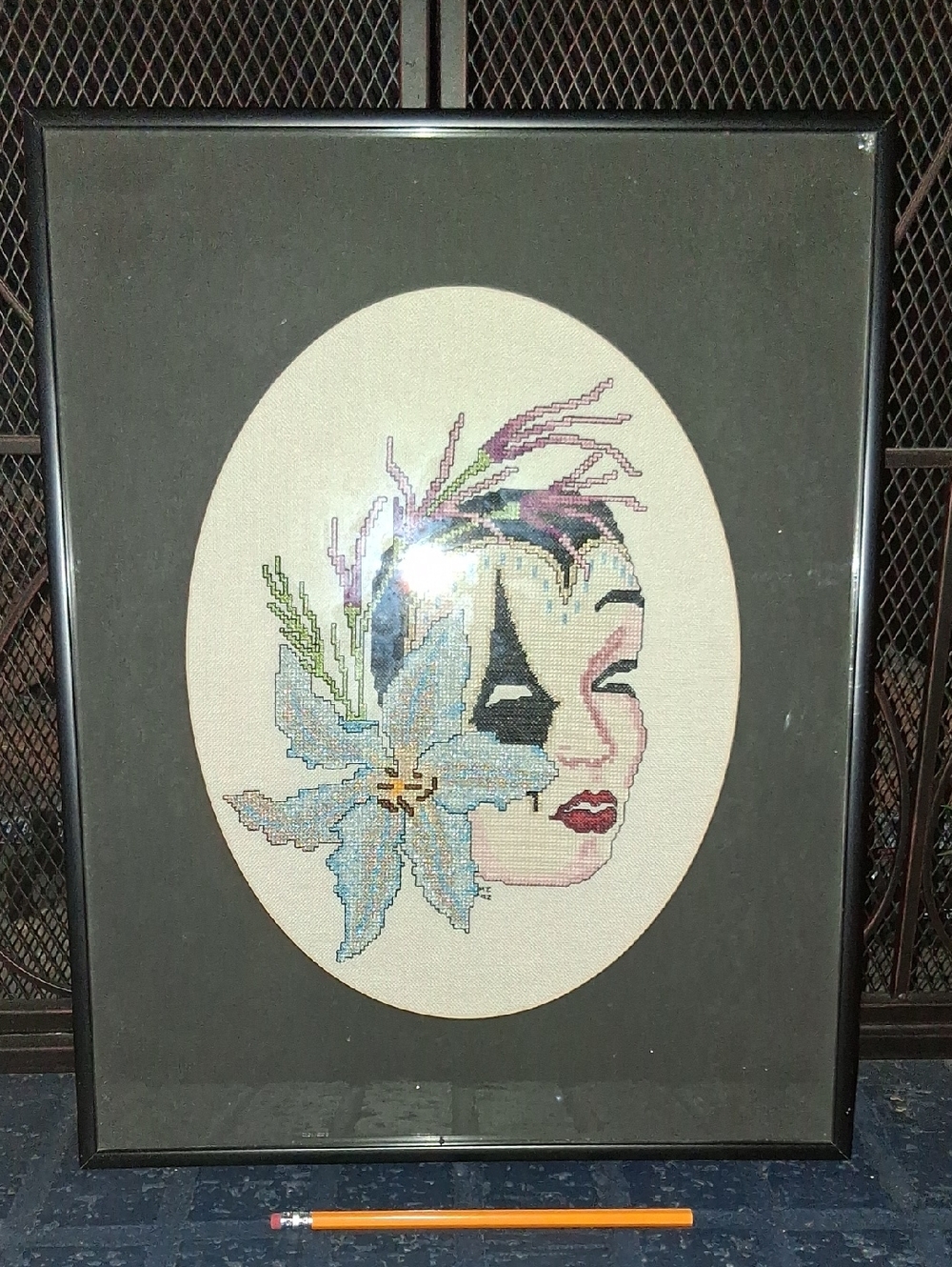 Framed Cross-Stitch Floral Face Artwork with Blue Lily